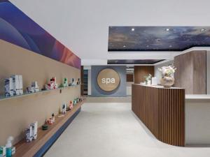 a spa lobby with a sign on the wall at Mercure Oradea in Oradea +45 photos