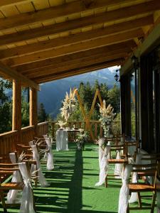 a set up for a wedding with chairs and tables at Chalet Hatsvali - Ushba Viewpoint Rooms & Café in Mestia +28 photos