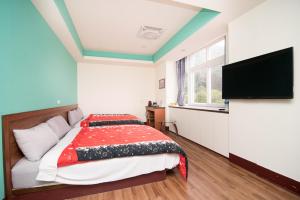 Postel nebo postele na pokoji v ubytování Nantou Xitou Riverside Homestay B&B