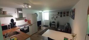 a kitchen with a sink and a counter top at Stuga PETEL in Färjestaden