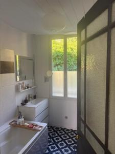a bathroom with a sink and a mirror at Cine in Sainte-Menehould