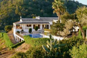 an aerial view of a house with a swimming pool at Herdade Da Corte in Tavira