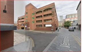 a large brick building on a city street at The Z Hotel Liverpool in Liverpool