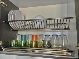 a row of glass jars on a shelf in a kitchen at Apartamento modero nuevo, 3 habitaciones y parqueadero en conjunto in Neiva