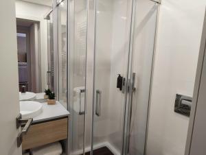 a bathroom with a shower and a sink at Porto & Douro Vista Apartments by Inviting in Valbom +191 photos