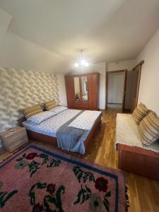 a bedroom with a bed and a rug at Villa Emina in Košelji