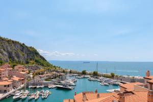 a group of boats docked in a harbor at Portopiccolo Apartments Deluxe in Sistiana