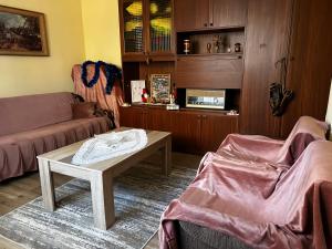 a living room with a couch and a table at Sremac in Kupinovo