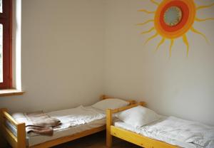 Ein Bett oder Betten in einem Zimmer der Unterkunft Hullam Hostel