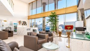 a lobby with couches and chairs in a building at توارن للشقق المخدومة - اقتصادي in Hail