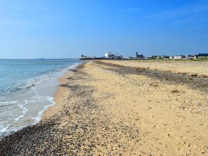 a beach with rocks and the ocean on a clear day at Rosemary - E4484A in Catfield