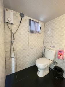 a bathroom with a toilet and a shower at Grace Riverfront Villa Near Suvarnabhumi Airport in Lat Krabang +46 photos