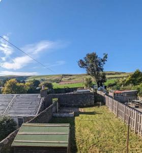 a view from the roof of a house with a fence at The Cottage @ 59 in Colmonell