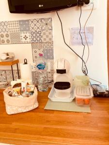 a kitchen counter with food items on a table at Casa Di Luce Junior Con Parcheggio Privato in Montesilvano +7 photos