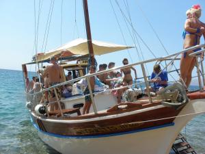 a group of people on a boat in the water at Athinas Art House in Kolymbia
