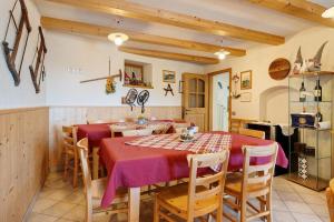 a dining room with a table and chairs at Agritur Maso Bornie in Grauno +57 photos