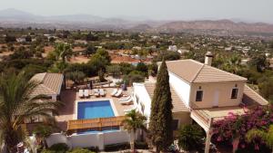 an aerial view of a house with a swimming pool at Finca Sonrisa in Alhaurín el Grande