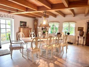a dining room with a table and chairs at Landhaus Hüttblek in Hüttblek