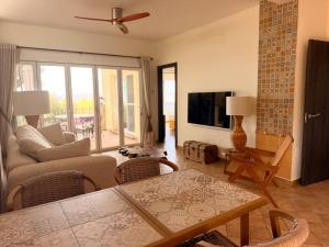 a living room with a couch and a table at Finca Sonrisa in Alhaurín el Grande