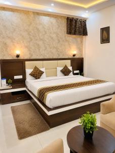 a bedroom with a large bed in a room at Mb View taj in Tājganj +10 photos