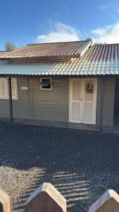 a house with a window and a garage at Casa vista do Vale in Farroupilha