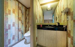 a bathroom with a sink and a toilet at Hotel Fiona in Seoul +24 photos