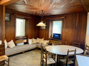 a living room with a couch and a table at Chalet Motta in Valtournenche