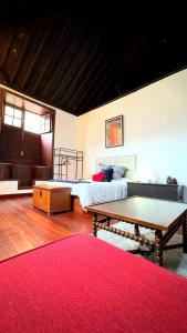 a bedroom with a bed and a ping pong table at Casa Tradicional Canaria - Gara in Garachico