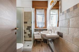 a bathroom with a sink and a mirror at Hotel Valentino - Bionaz in Bionaz +84 photos