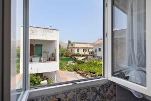 a view from the window of a house at The Nice Bright House in Palermo