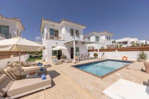 an image of a villa with a swimming pool at Fig Tree Beach villa Three in Protaras