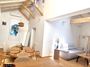a living room with a table and a couch at Si apartments Free Parking in Sofia