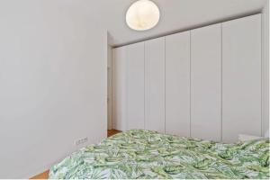 a bedroom with a bed and a large mirror at Royal Hamilius Luxury 1 bed in Luxembourg