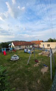 a group of playground equipment in a yard at Ubytovanie u Richtára in Klokoč