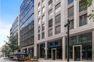 a large building on a street in a city at Royal Hamilius Luxury 1 bed in Luxembourg