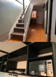 a view of a staircase with a kitchen and a living room at Taltal - Casa Nordic in Taltal