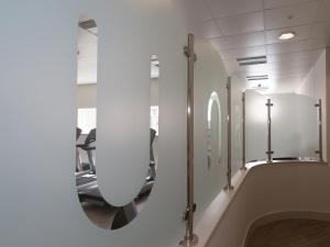 a bathroom with a mirror and a bath tub at Una Argentum 62 in Carbis Bay