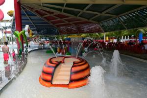 an amusement park with a slide in the water at Spazzio diRoma - Apartamentos JN in Caldas Novas