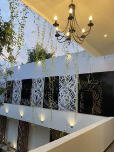 a chandelier hangs from the ceiling in a lobby at Rest Inn Tourist Hotel in Gampaha