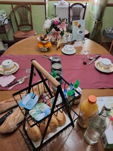 a table with a bunch of bread on it at La Parenthese in Folles +44 photos