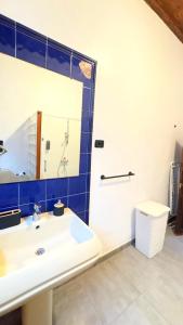 a bathroom with a white sink and a mirror at Casa Tradicional Canaria in Garachico +37 photos
