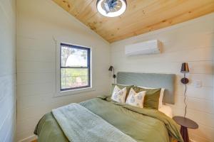 a bedroom with a bed in a small room at Off-Grid & Solar-Powered! Mtn-View Omaha Cabin in Omaha