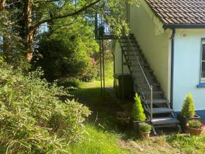 a stairway leading to the side of a house at Perfect for two close to Kenmare in Kenmare