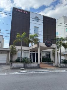 a hotel with a sign on the front of it at Add Hotéis Center Norte in São Paulo