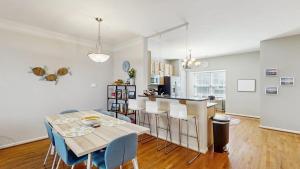 a kitchen and dining room with a table and chairs at Rehoboth Crossing --- 19913 Ames Drive #106 in Rehoboth Beach