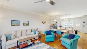 a living room with a couch and chairs and a table at Rehoboth Crossing --- 19913 Ames Drive #106 in Rehoboth Beach