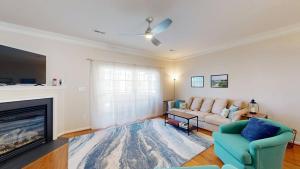 a living room with a couch and a fireplace at Rehoboth Crossing --- 19913 Ames Drive #106 in Rehoboth Beach +24 photos