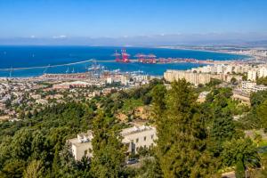an aerial view of a city and the ocean at Marom Residence Romema in Haifa