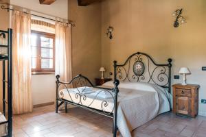 a bedroom with a bed and a window at Agriturismo Fontesomma in Apecchio +75 photos