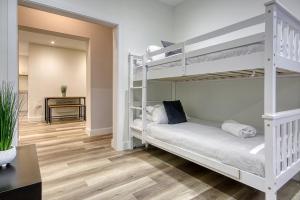 a bedroom with two bunk beds and a desk at The Studio Castle Lane in Bournemouth